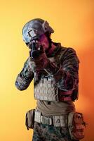 modern soldier against yellow background photo