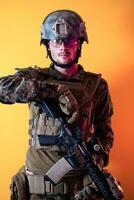 modern soldier against yellow background photo