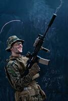 soldier firing into the air in front of black chalkboard photo