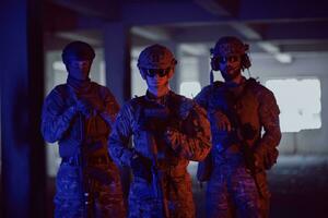 soldier squad team portrait in urban environment colored lightis photo