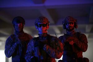 soldier squad team portrait in urban environment colored lightis photo