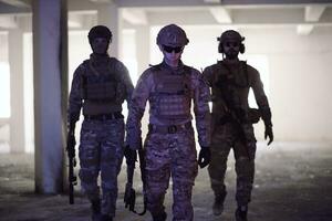 soldier squad team portrait in urban environment colored lightis photo