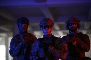 soldier squad team portrait in urban environment colored lightis photo