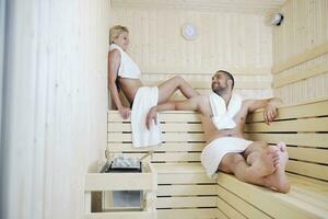 happy young couple in sauna photo