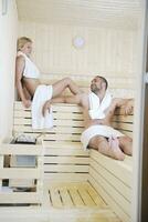 happy young couple in sauna photo