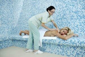 woman relaxing at spa and wellness photo