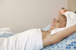 woman relaxing at spa and wellness photo