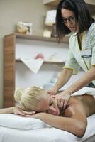 woman at spa and wellness back massage photo