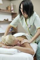 woman back massage treatment photo