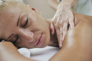 woman back massage treatment photo