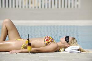 beautiful woman relax on swimming pool photo