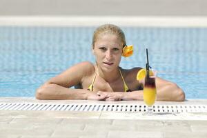 beautiful woman relax on swimming pool photo