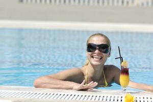 beautiful woman relax on swimming pool photo