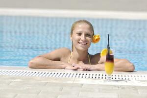 beautiful woman relax on swimming pool photo