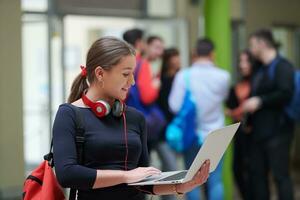 famel student with modern technology in school photo