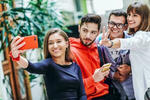 Group of multiethnic teenagers taking a selfie in school photo