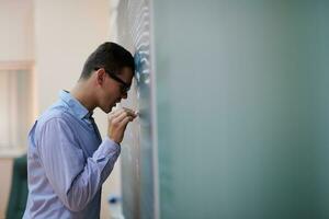 the student does the task on the board photo