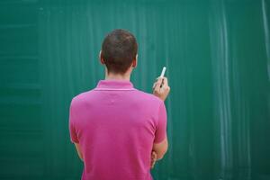 the student does the task on the board photo