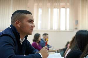 student taking notes while studying in high school photo