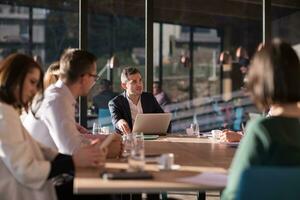 Business Team At A Meeting at modern office building photo