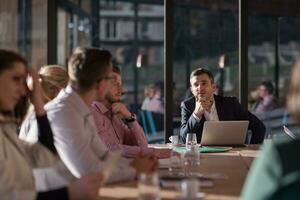 Business Team At A Meeting at modern office building photo