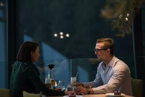 Couple on a romantic dinner at the restaurant photo