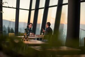 Couple on a romantic dinner at the restaurant photo