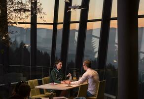 Couple on a romantic dinner at the restaurant photo