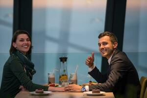 Couple on a romantic dinner at the restaurant photo