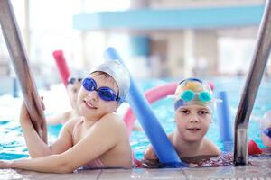 happy children group  at swimming pool photo