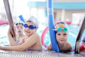 happy children group  at swimming pool photo