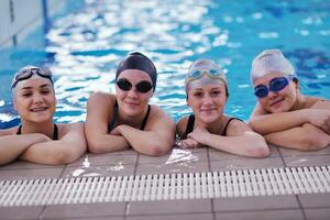 happy teen group  at swimming pool photo