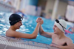 happy teen group  at swimming pool photo