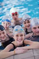 happy teen group  at swimming pool photo