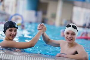 happy children group  at swimming pool photo