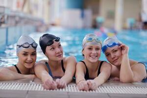 happy teen group  at swimming pool photo