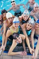 happy teen group  at swimming pool photo