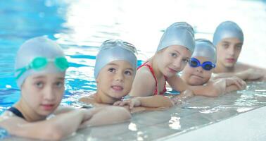 children group  at swimming pool photo