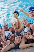 happy teen group  at swimming pool photo