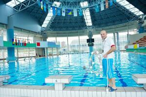 help and rescue on swimming pool photo