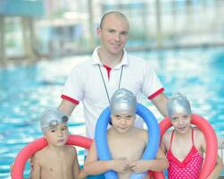 children group  at swimming pool photo