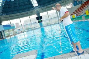 help and rescue on swimming pool photo