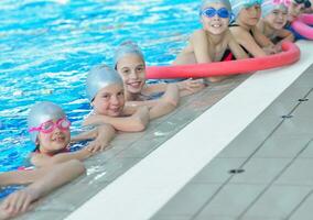 children group  at swimming pool photo