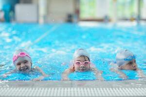 children group  at swimming pool photo