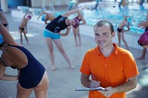 happy children group  at swimming pool photo