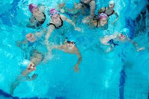 happy childrens at swimming pool photo