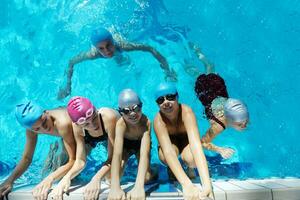 happy children group  at swimming pool photo