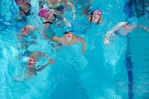 happy children group  at swimming pool photo