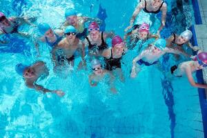 happy children group  at swimming pool photo