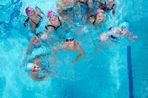 happy children group  at swimming pool photo